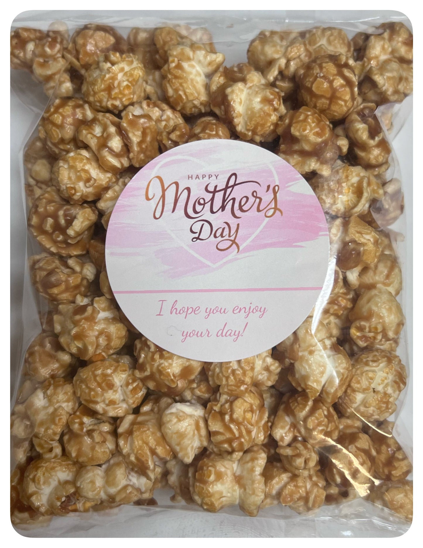 Mother's Day Snack Bag with custom logo and pink label filled with caramel popcorn.