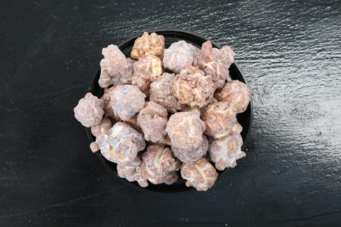 Puppy Chow snack mix with chocolate, peanut butter, and powdered sugar.