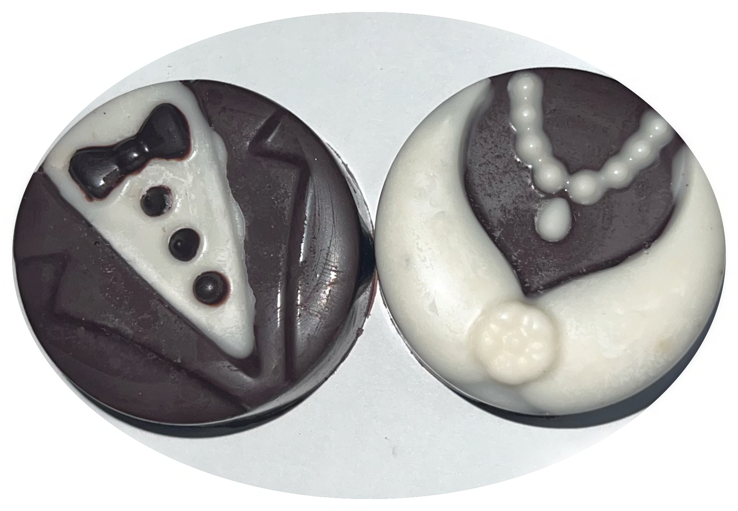 Wedding chocolate covered cookies with tuxedo and gown designs.