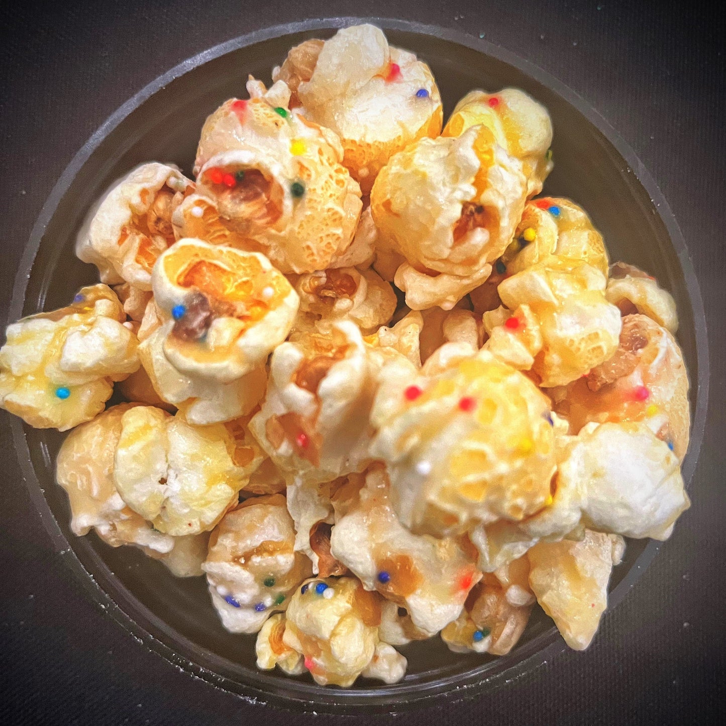 Birthday cake flavored popcorn with colorful sprinkles.