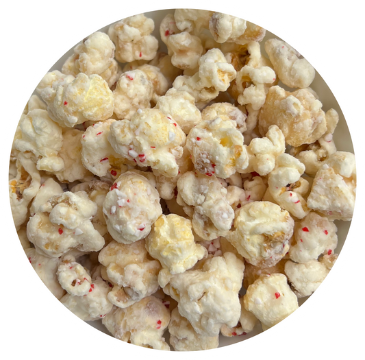 Peppermint white chocolate-covered popcorn with red specks.