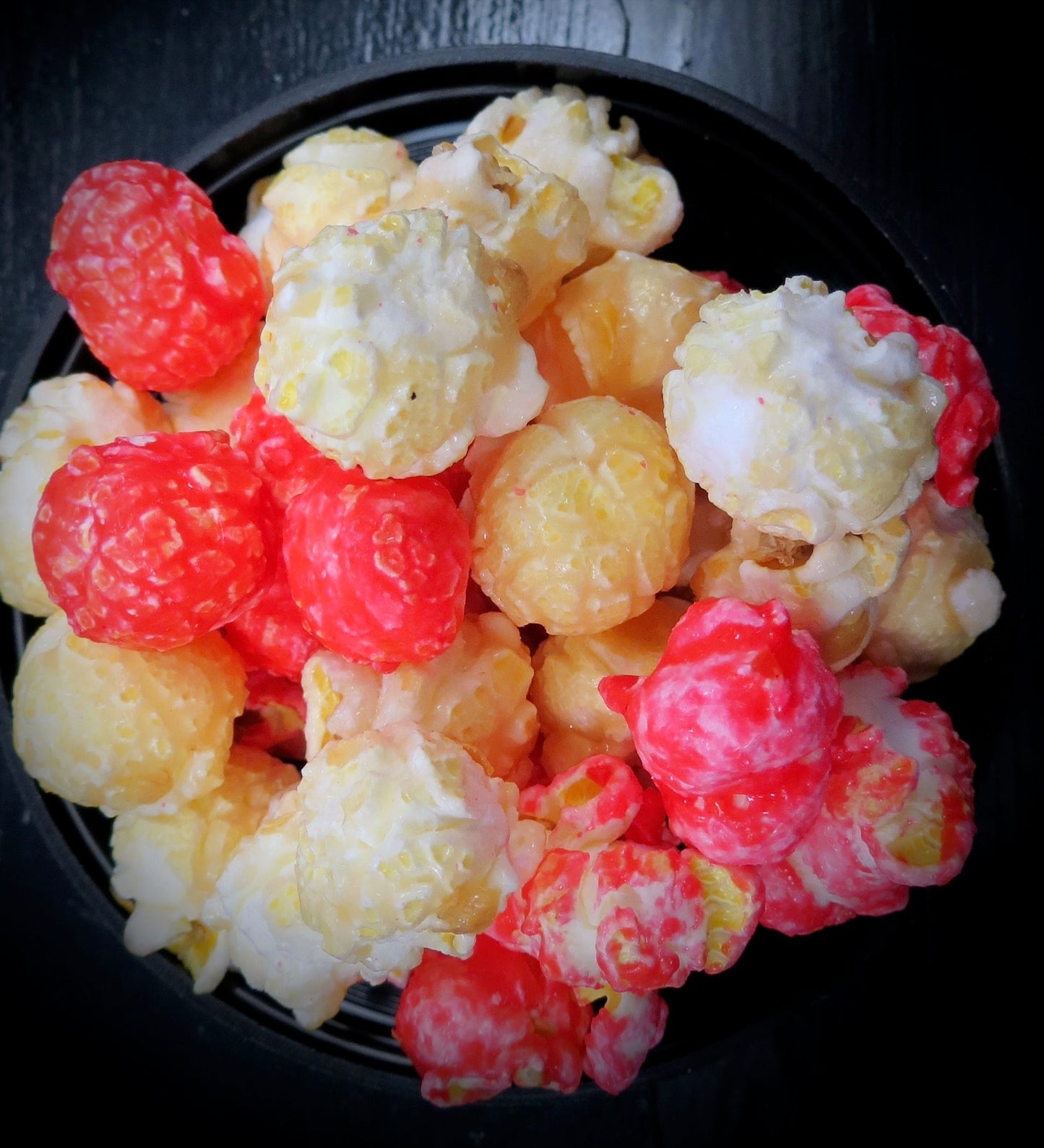 Tequila Sunrise strawberry and tequila flavored popcorn in a bowl.
