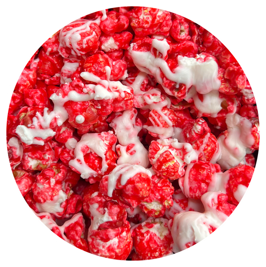 Cinnamon white chocolate popcorn with drizzle.