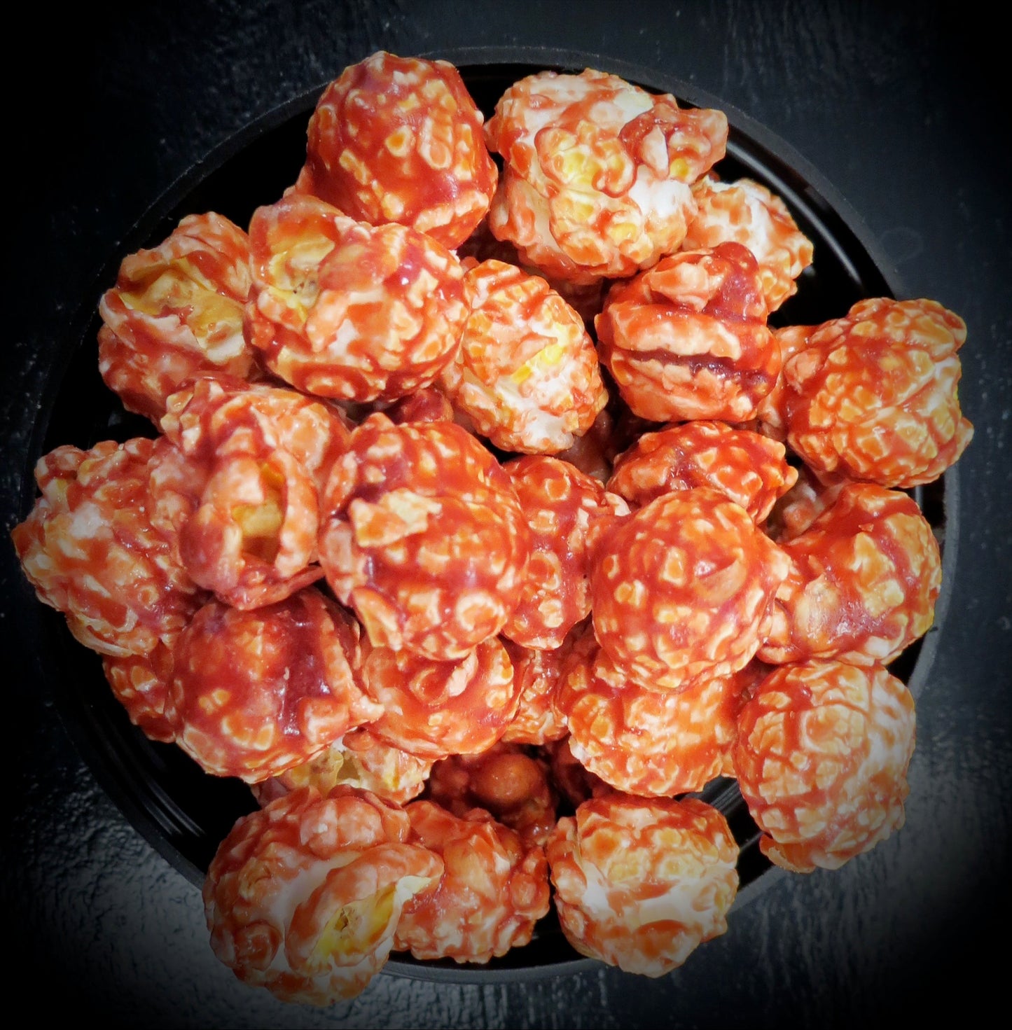 Nutty flavored popcorn with rich amaretto taste, alcohol-free.
