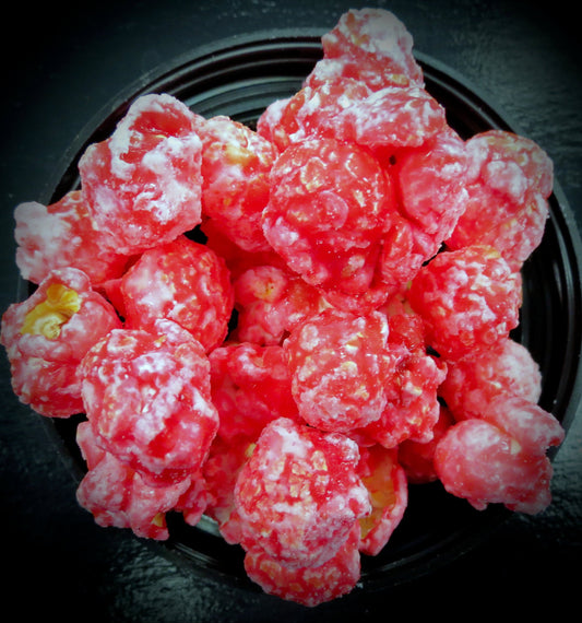 Red cinnamon-flavored popcorn with a sweet and spicy coating.
