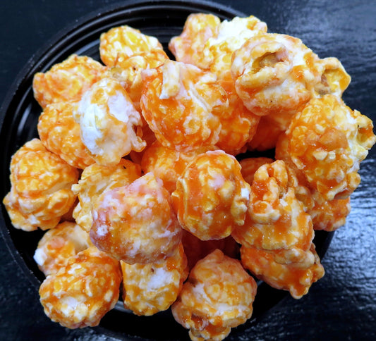 Dr. Pop flavored popcorn in a bowl, featuring caramel and cheese coatings.