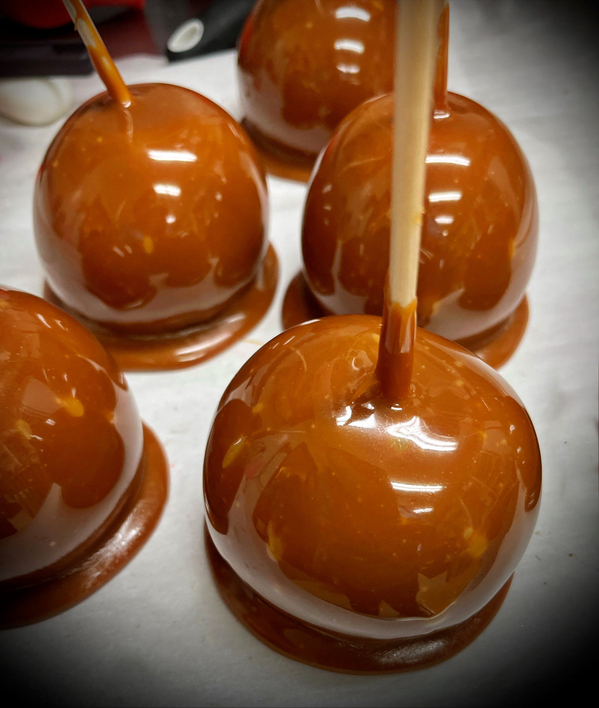 Juicy green apple coated with rich caramel