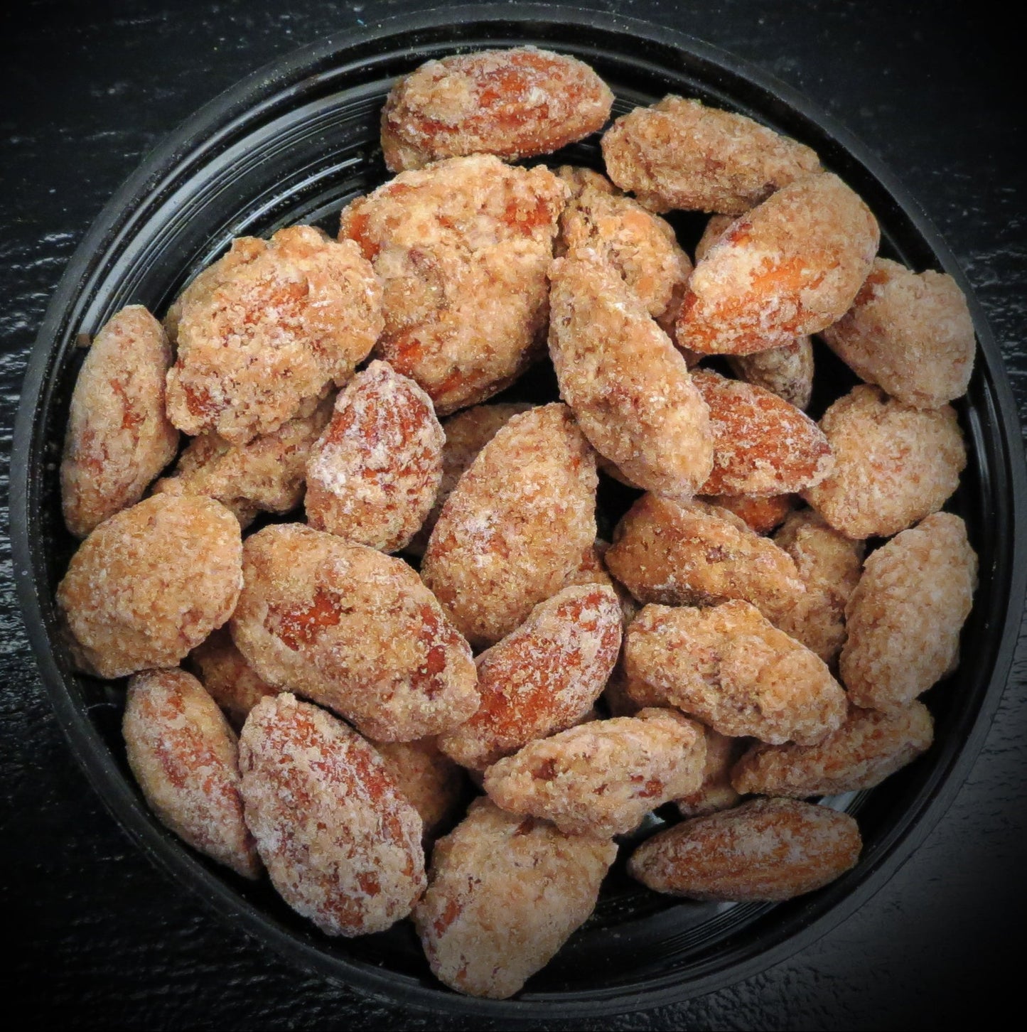 Amaretto almonds with sugar, vanilla, and pecans in a bowl.