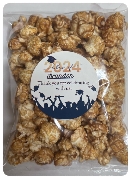 Graduation snack bag with custom logo and thank you message on caramel popcorn.