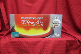 Color Changing Whirley Pop popcorn maker packaging on a red background.