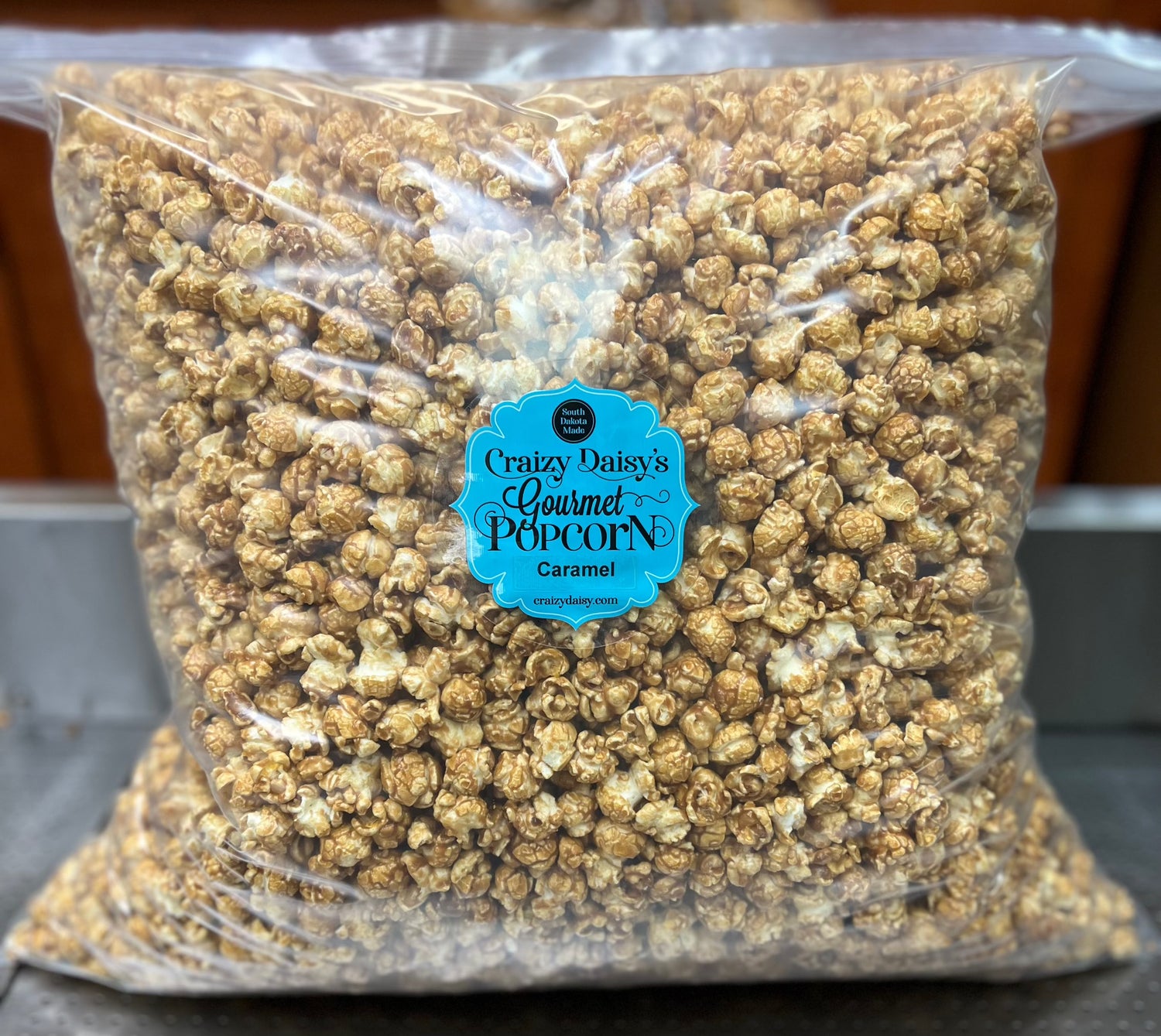 Pillow bags filled with caramel popcorn, holding 15 gallons, 24x24 size.