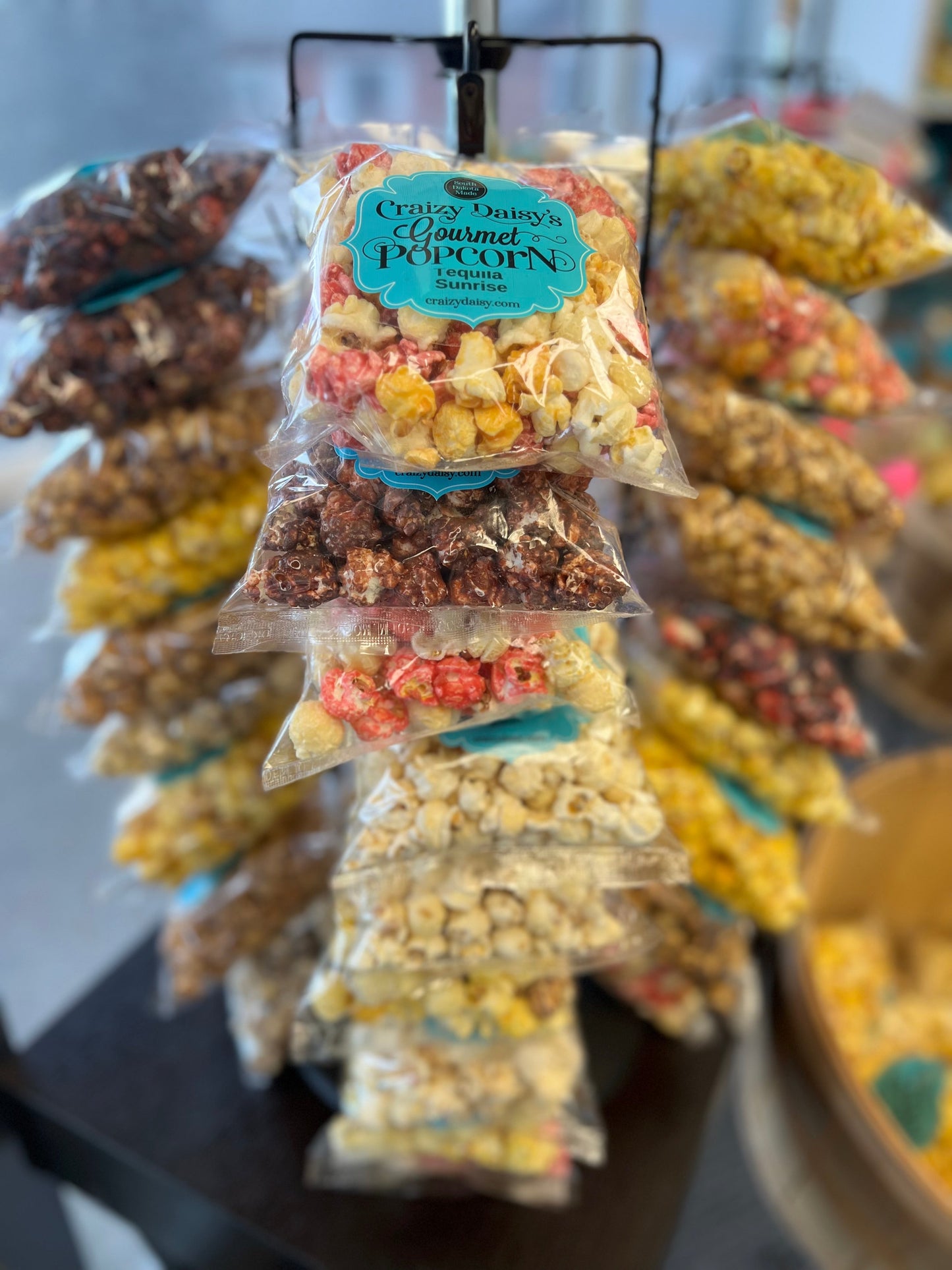 Snack bags filled with assorted popcorn flavors, available for bulk purchase and personalization.