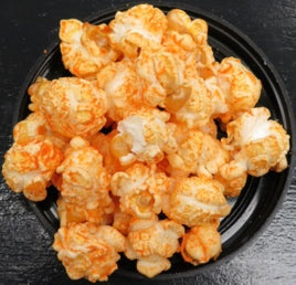 Bacon Cheddar popcorn with smoky bacon and creamy cheddar flavors.