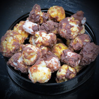 Marshmallow flavored popcorn with chocolate, mini marshmallows, and graham crackers.